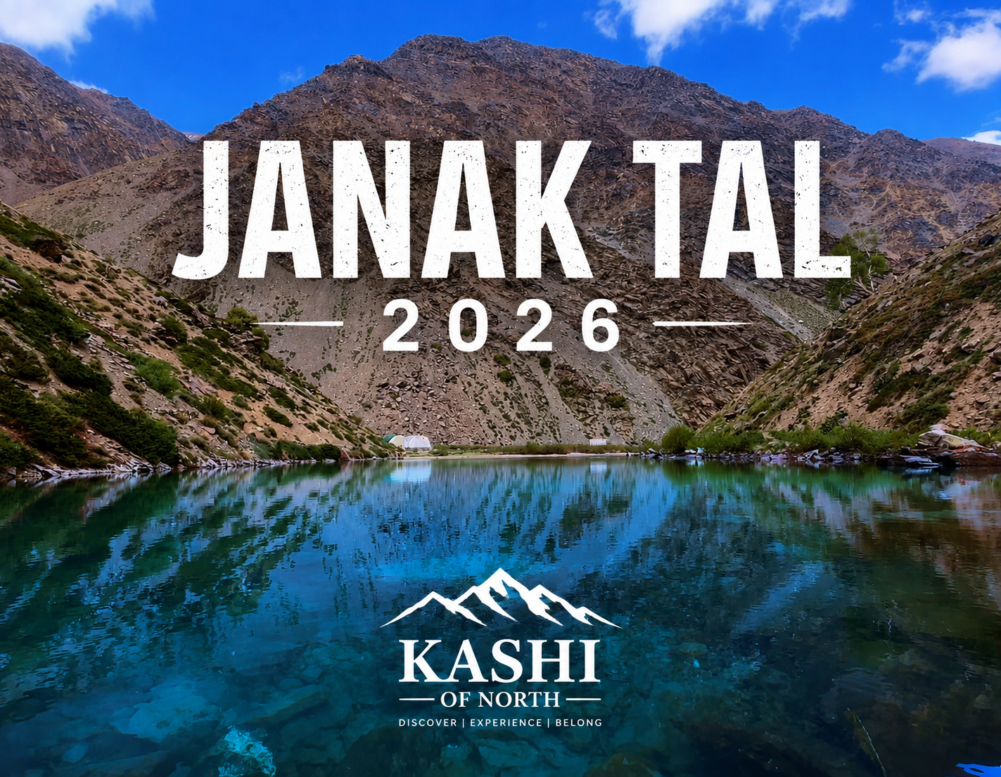 Janak Tal 2026 alpine lake in Uttarkashi, Uttarakhand, reflecting rugged Himalayan mountains and blue sky, with Kashi of North branding.
